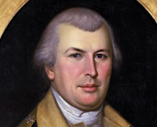 Portrait of a man in an oval frame wearing a blue uniform coat of the Continental Army with buff lapels and epaulets on his shoulders. 